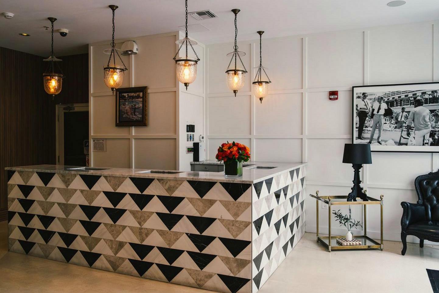 Brightvibes Hotel elegant sunlit lobby with modern coastal design