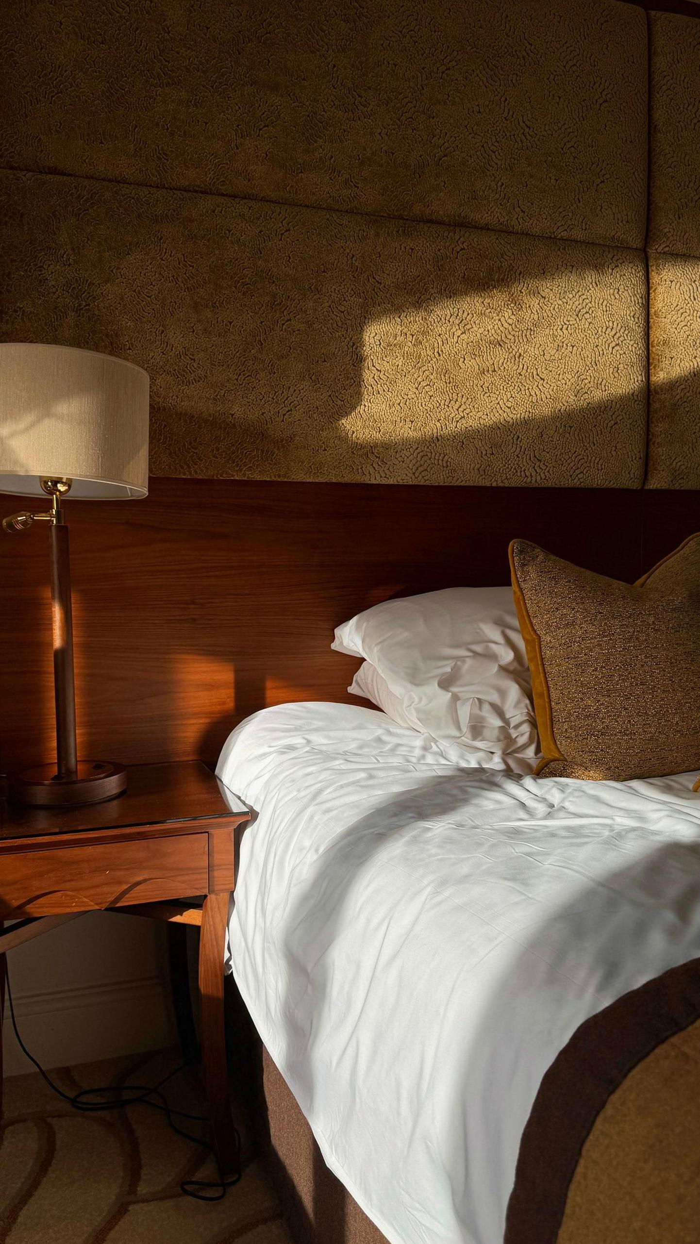Sunlit Brightvibes room interior with warm wood and soft linens