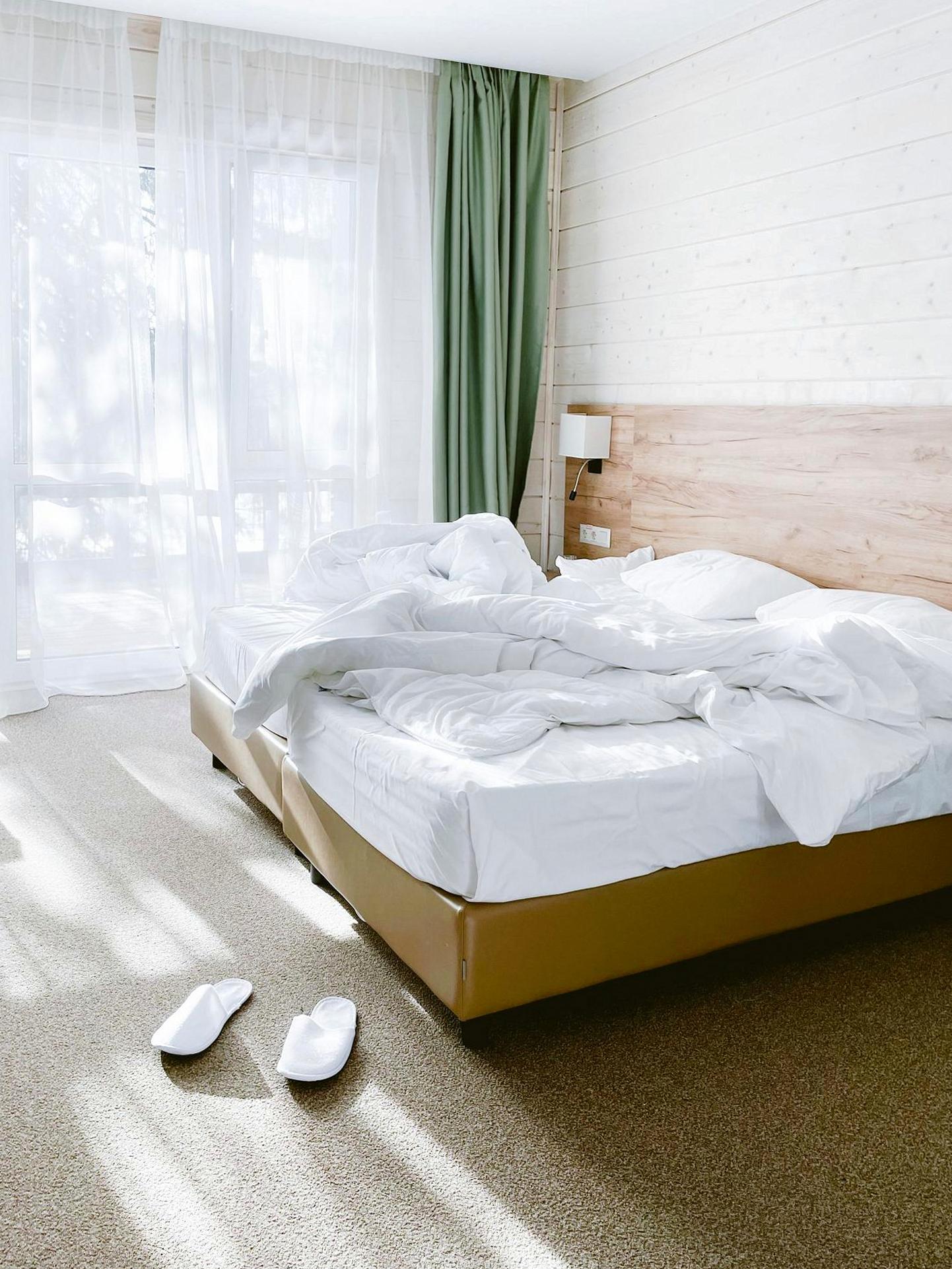 Sun-lit Brightvibes hotel room with soft linens